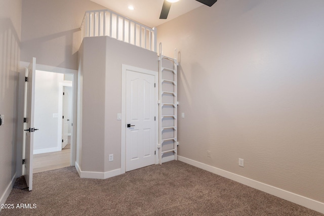 1062 N Robin Ln, Mesa, AZ 85213 - unfurnished bedroom with carpet floors, baseboards, a high ceiling, and ceiling fan