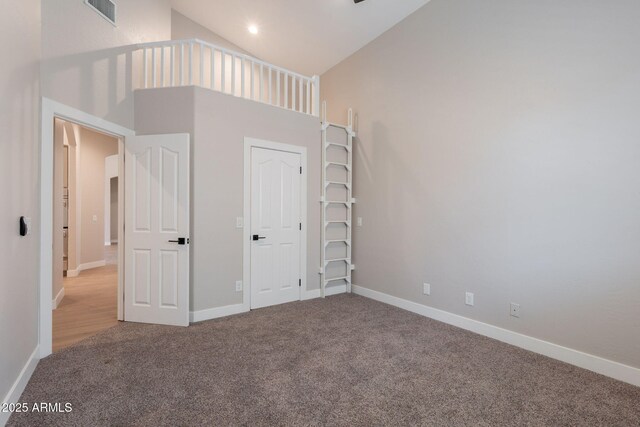 1062 N Robin Ln, Mesa, AZ 85213 - unfurnished bedroom featuring carpet floors, a towering ceiling, and baseboards