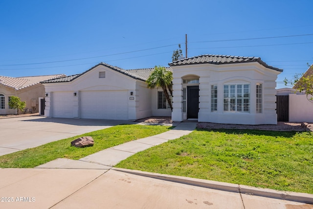 1062 N Robin Ln, Mesa, AZ 85213 - mediterranean / spanish-style house with a tile roof, a garage, driveway, a front yard, and stucco siding