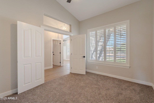 1062 N Robin Ln, Mesa, AZ 85213 - spare room with carpet floors, vaulted ceiling, baseboards, and a ceiling fan
