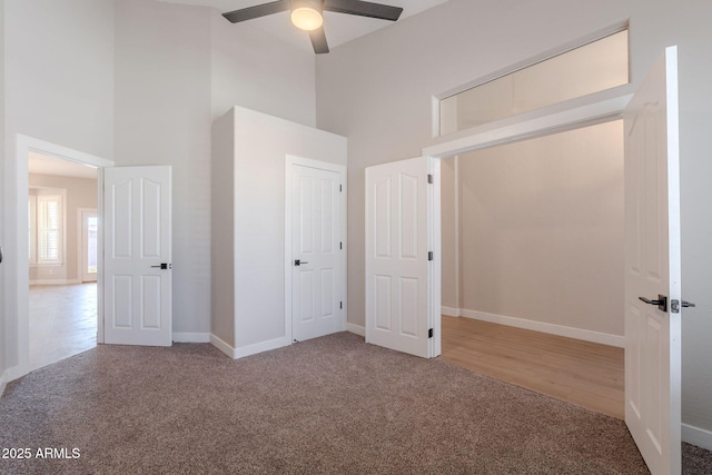 1062 N Robin Ln, Mesa, AZ 85213 - unfurnished bedroom featuring a towering ceiling, carpet floors, baseboards, and ceiling fan