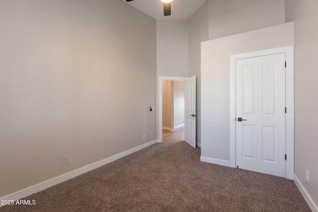 1062 N Robin Ln, Mesa, AZ 85213 - unfurnished bedroom with carpet floors, baseboards, a high ceiling, and a ceiling fan