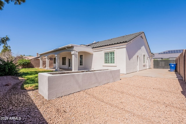 1062 N Robin Ln, Mesa, AZ 85213 - back of house with a patio, stucco siding, a fenced backyard, and a tile roof