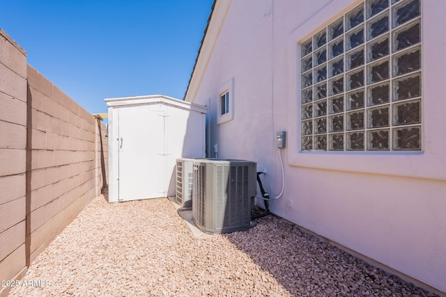 1062 N Robin Ln, Mesa, AZ 85213 - view of home's exterior featuring cooling unit and stucco siding