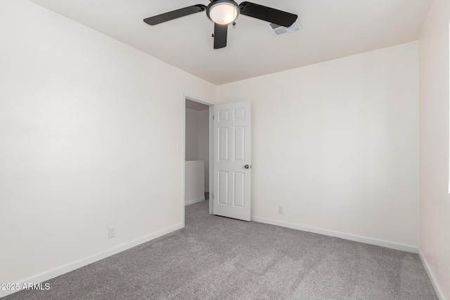 1644 W Mountain View Rd, Phoenix, AZ 85021 - spare room featuring light colored carpet, a ceiling fan, and baseboards