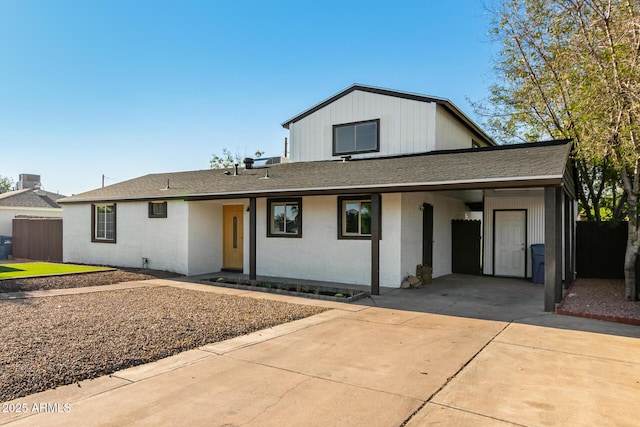 1644 W Mountain View Rd, Phoenix, AZ 85021 - view of front of house featuring concrete driveway, an attached carport, and roof with shingles