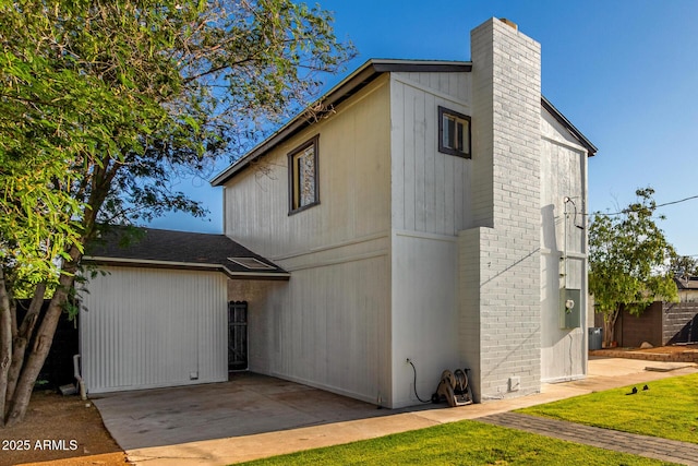 1644 W Mountain View Rd, Phoenix, AZ 85021 - view of front of house featuring a chimney, a patio, brick siding, and a front yard