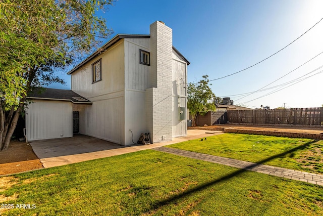 1644 W Mountain View Rd, Phoenix, AZ 85021 - back of house featuring a patio and a chimney