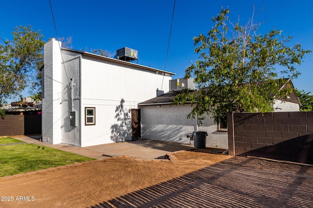 1644 W Mountain View Rd, Phoenix, AZ 85021 - view of side of property with central AC unit and a patio