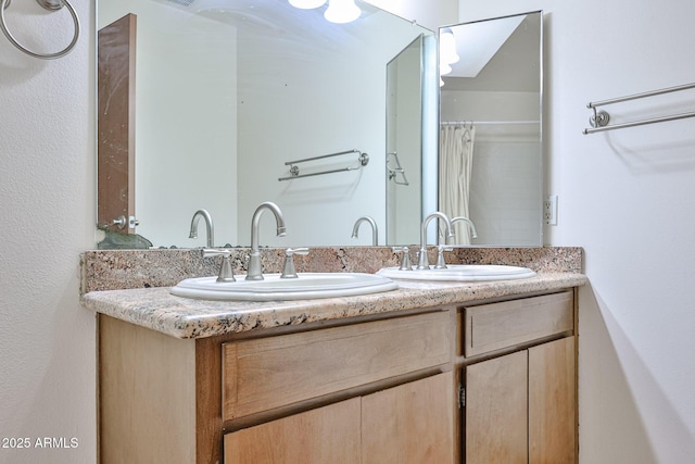 full bath featuring a sink and double vanity
