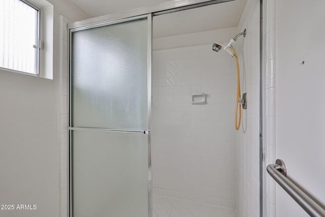 full bath with a shower stall