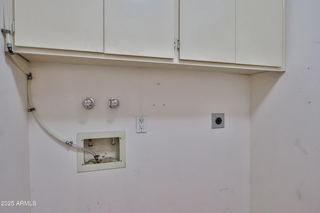laundry area featuring hookup for a washing machine, cabinet space, gas dryer hookup, and electric dryer hookup