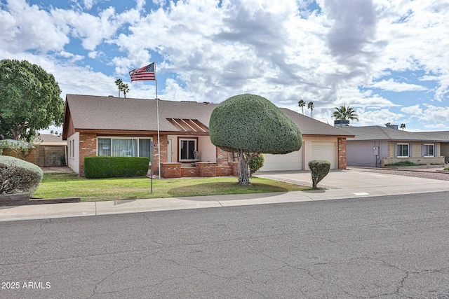 view of front facade featuring brick siding, a front lawn, fence, concrete driveway, and an attached garage