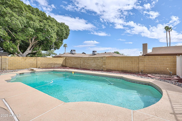 view of swimming pool with a patio area, a fenced in pool, a fenced backyard, and a diving board