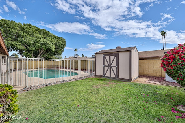 view of swimming pool featuring a fenced in pool, a shed, a lawn, an outdoor structure, and a fenced backyard