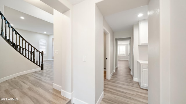 corridor featuring light hardwood / wood-style floors