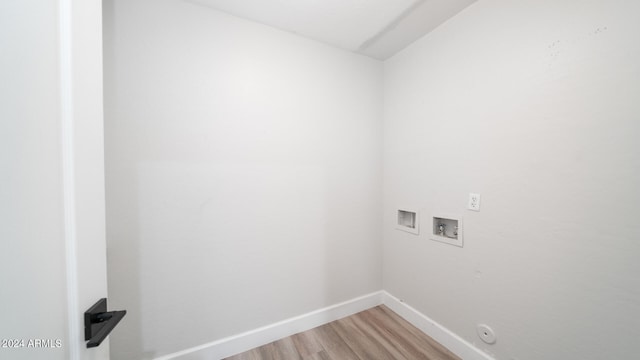 washroom featuring washer hookup, hardwood / wood-style flooring, and gas dryer hookup