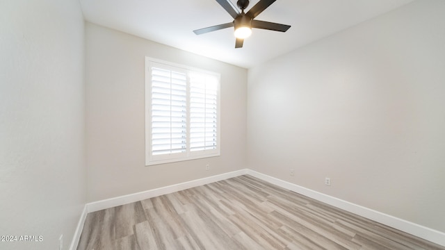 spare room featuring ceiling fan and light hardwood / wood-style flooring