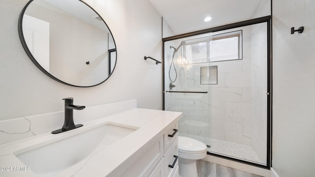 bathroom with hardwood / wood-style flooring, vanity, toilet, and a shower with shower door