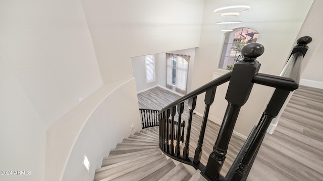 stairway featuring hardwood / wood-style flooring