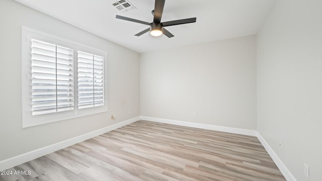 empty room featuring ceiling fan and light wood-type flooring