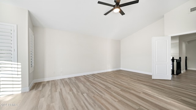 unfurnished living room with vaulted ceiling, ceiling fan, and light wood-type flooring