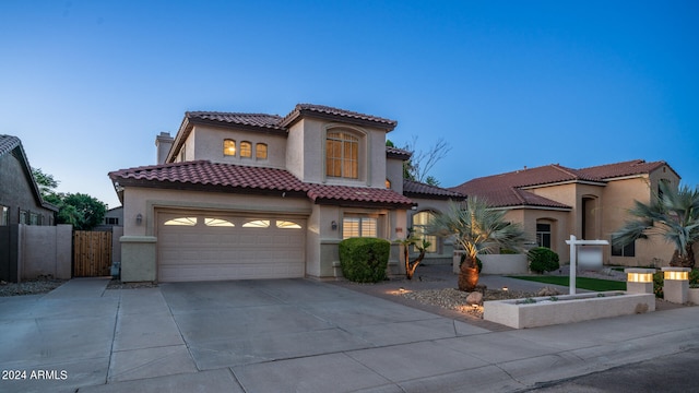 mediterranean / spanish-style home featuring a garage