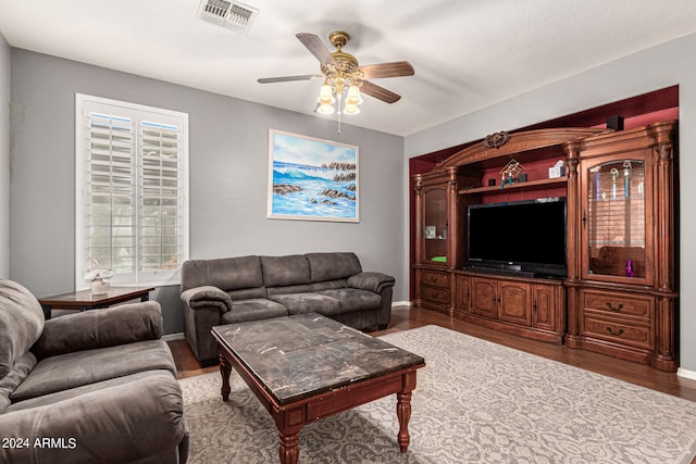 living room featuring plenty of natural light, hardwood / wood-style floors, and ceiling fan