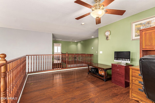 office space featuring dark hardwood / wood-style flooring and ceiling fan