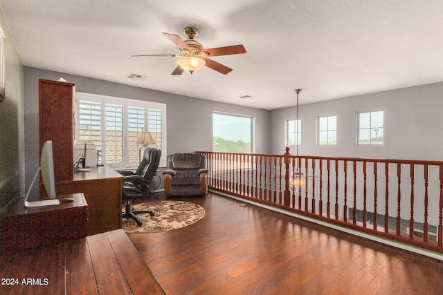 office space featuring a textured ceiling, ceiling fan, and wood-type flooring