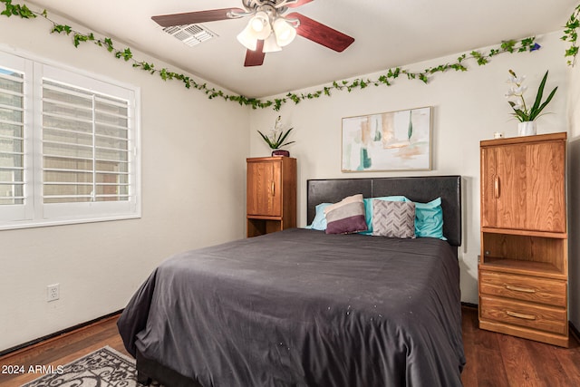 bedroom featuring dark wood-type flooring and ceiling fan