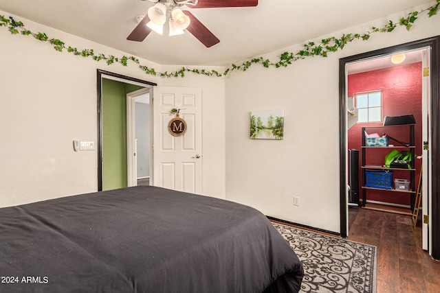 bedroom featuring dark hardwood / wood-style flooring and ceiling fan