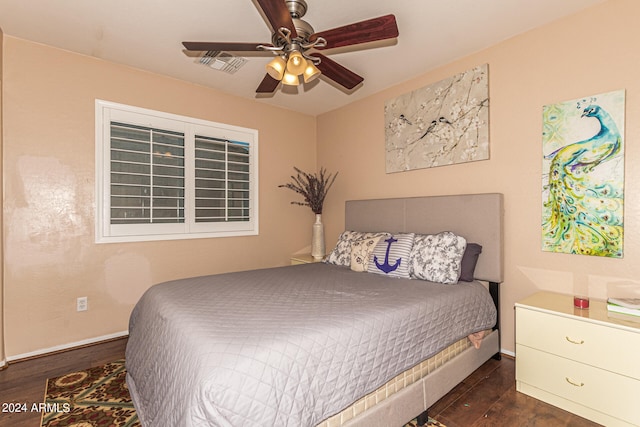 bedroom with ceiling fan and dark hardwood / wood-style floors