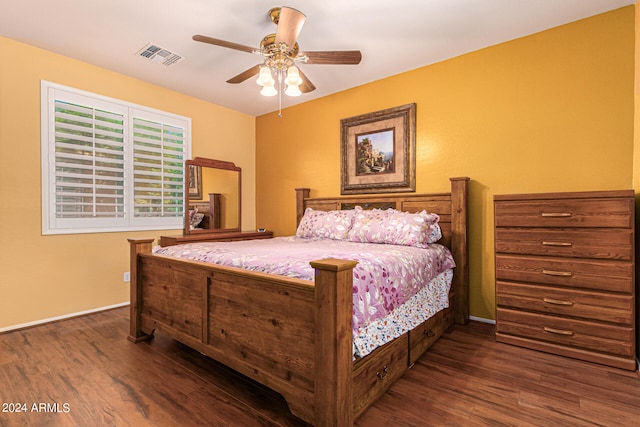 bedroom featuring ceiling fan and dark hardwood / wood-style floors