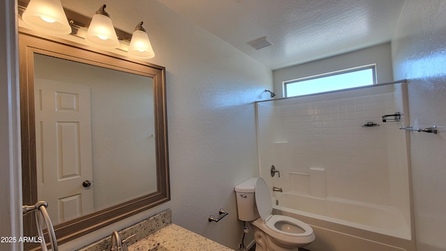 full bath featuring toilet,  shower combination, visible vents, and a textured ceiling
