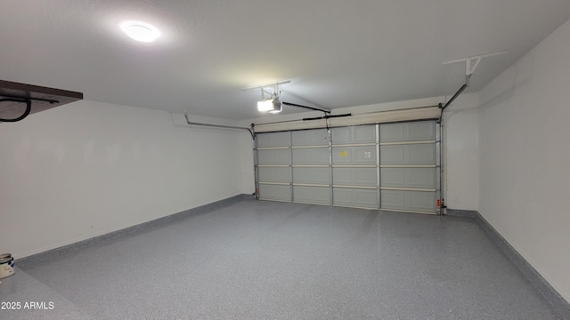 garage with baseboards and a garage door opener