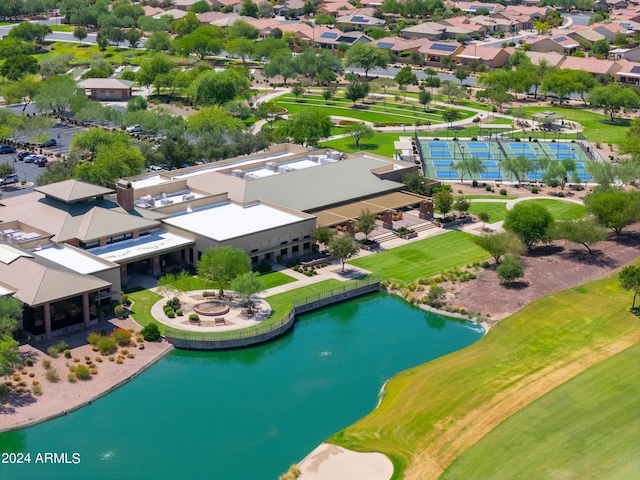 drone / aerial view with a water view and a residential view