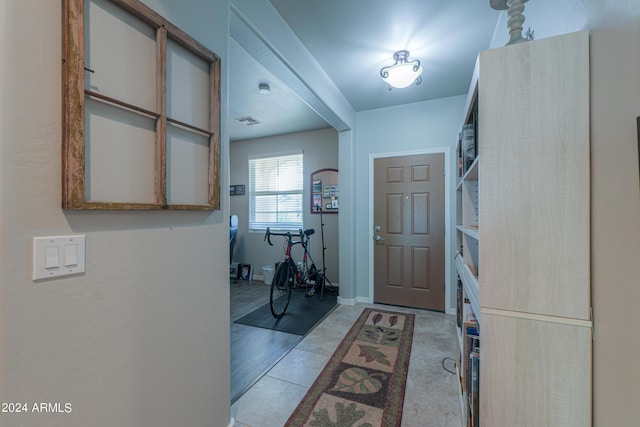 entryway featuring baseboards and visible vents