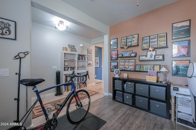 home office featuring baseboards and wood finished floors