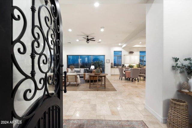 entryway featuring ceiling fan