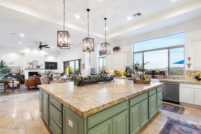 kitchen featuring green cabinetry, white cabinetry, and a kitchen island