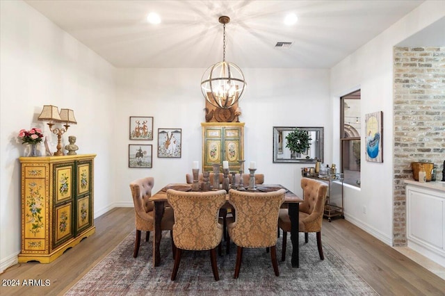 dining space featuring a chandelier and dark hardwood / wood-style flooring