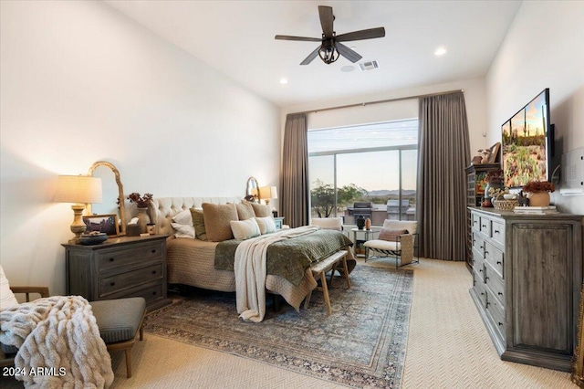 carpeted bedroom featuring vaulted ceiling and ceiling fan