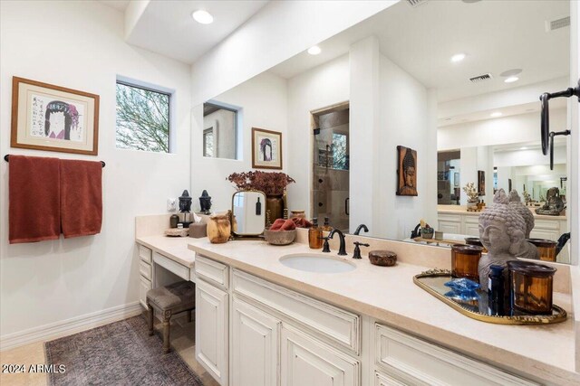 bathroom with vanity and an enclosed shower