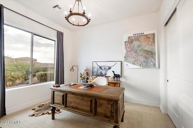 home office with light carpet and a notable chandelier