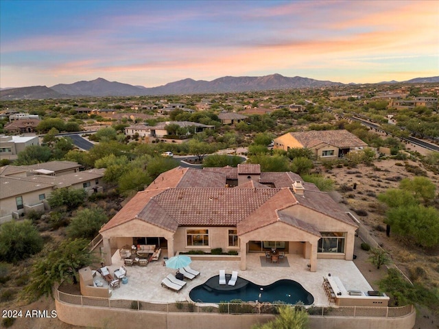 aerial view at dusk with a mountain view