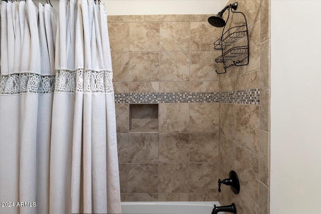 details featuring shower / bath combination with curtain