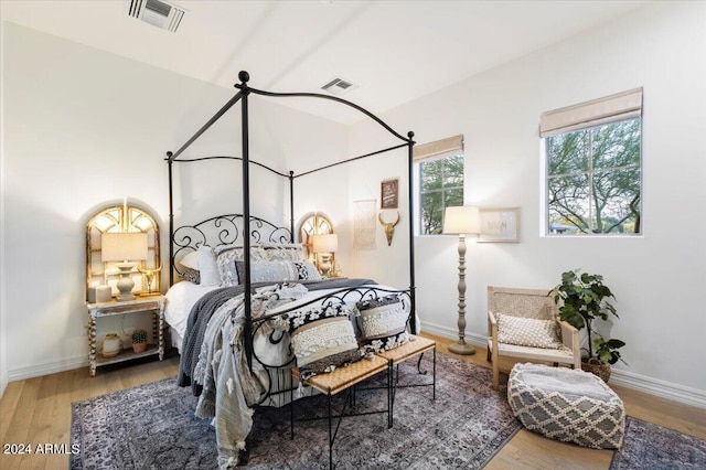 bedroom with hardwood / wood-style flooring