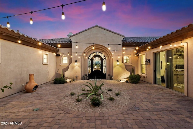 view of patio terrace at dusk