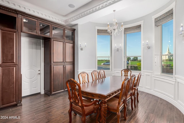 dining area featuring dark hardwood / wood-style flooring and a notable chandelier